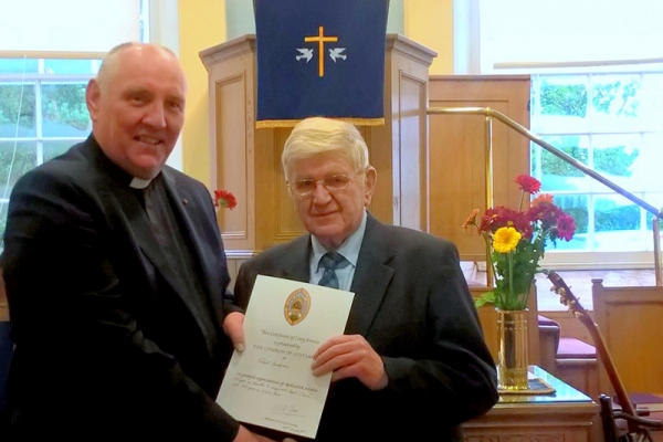 rev-dr-peter-mills-presents-beadle-mr-robert-anderson-with-long-service-certificate-in-recognition-of-his-50-years-as-beadle-and-35-years-as-elderE394C227-4D18-25AD-6F59-01D2880C8130.jpg